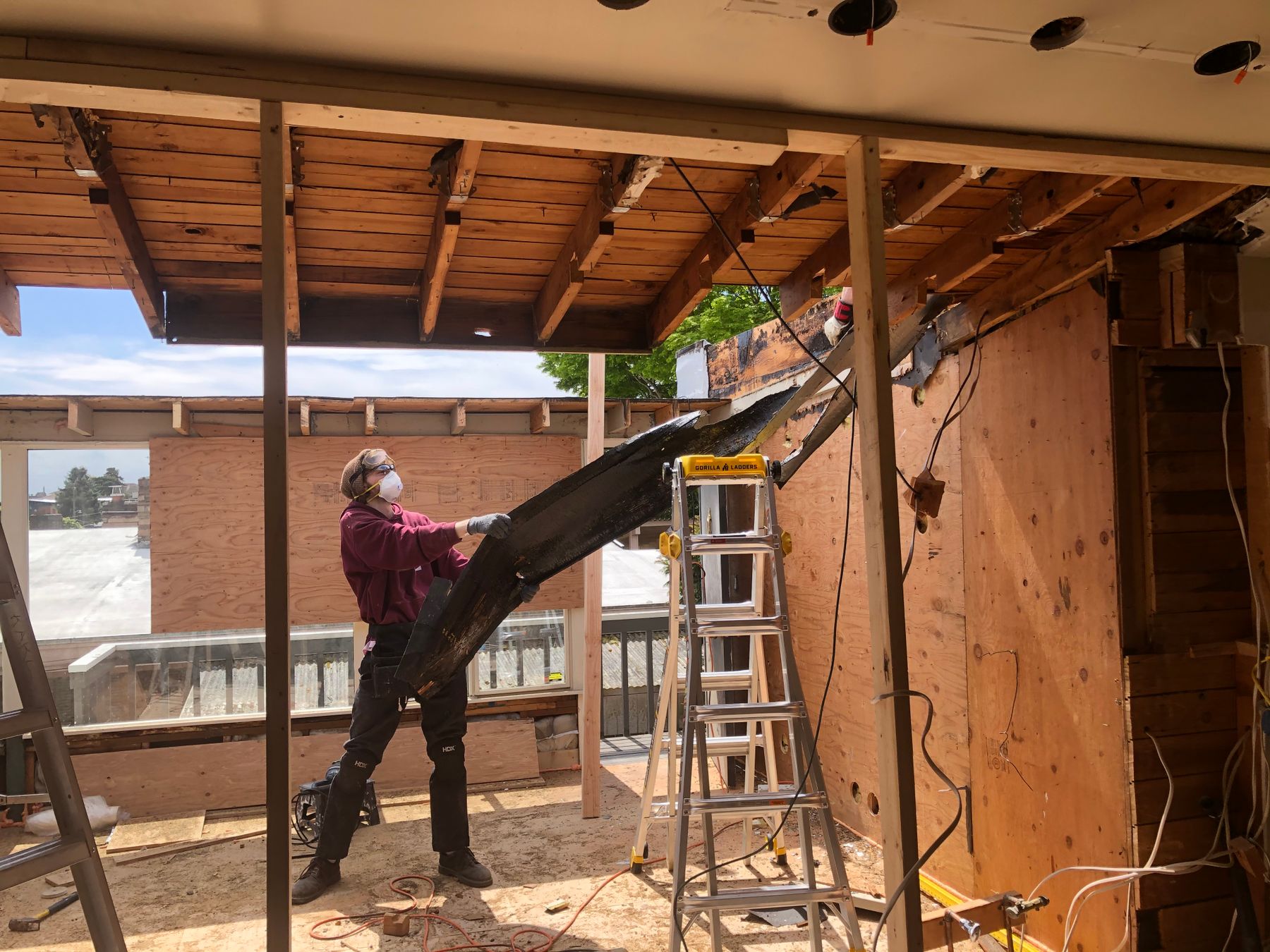 Construction professional working on the exterior structure of a house extension